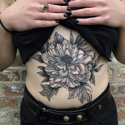 big tattoo on stomach