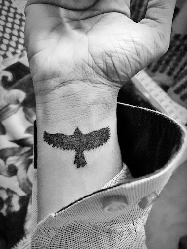 bird tattoo on wrist