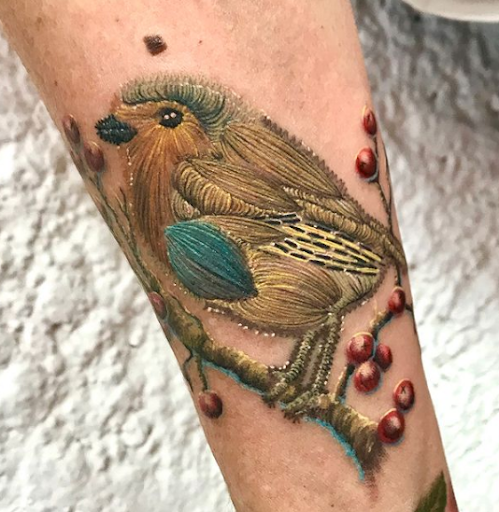 Embroidery tattoo design of a bird Embroidery tattoo design of a bird with very fine thread lines on a branch