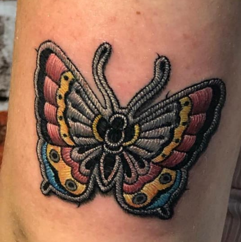 Embroidery tattoo of a butterfly