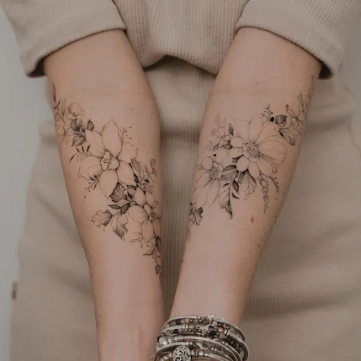 Fine line matching forearm flower tattoos
