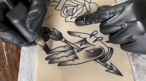 hand and arrow tattoo 2