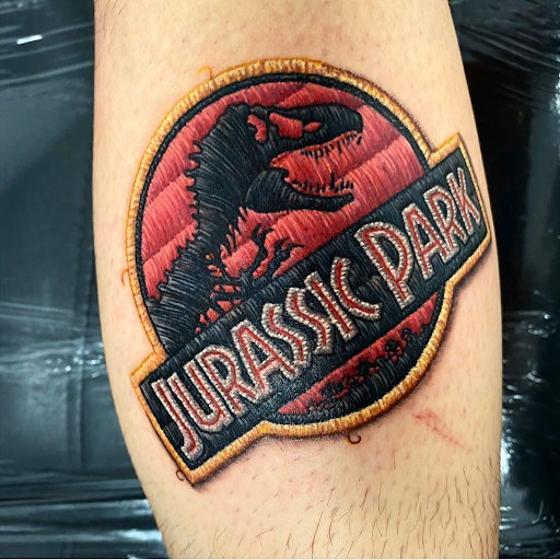 Jurassic Park logo by Eduardo Duda Lozano Embroidered patch tattoos of the Jurassic Park logo by Eduardo Duda Lozano