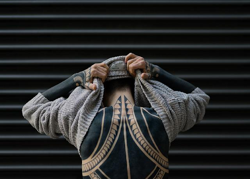 Man with back tattoo