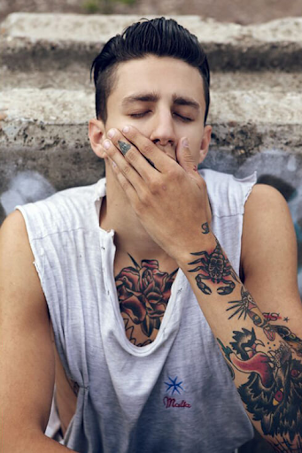 Model posing with tattoos visible Model posing with tattoos visible