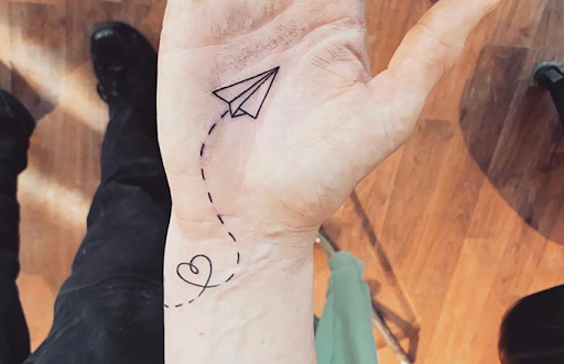 paper plane tattoo hand tattoo of paper plane
