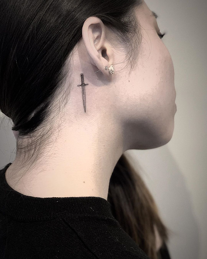 rose tattoo on thin skin ear and neck tattoo