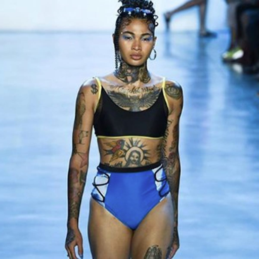 runway model with multiple visible tattoos runway model with multiple visible tattoos