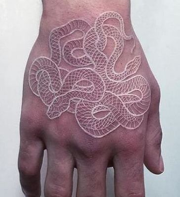 White ink tattoo on the hand