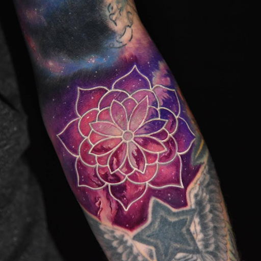 white ink tattoo over colour tattoo