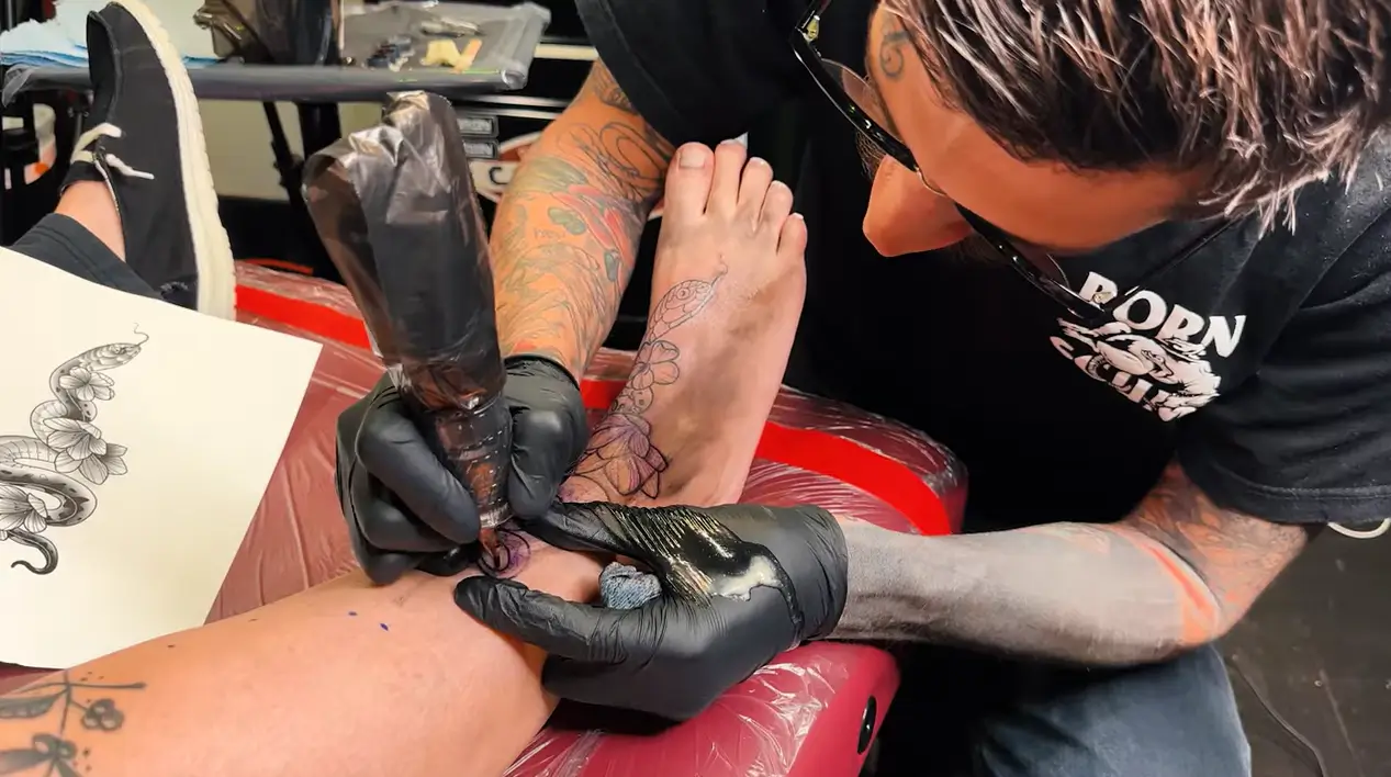 Tattoo artist tattooing